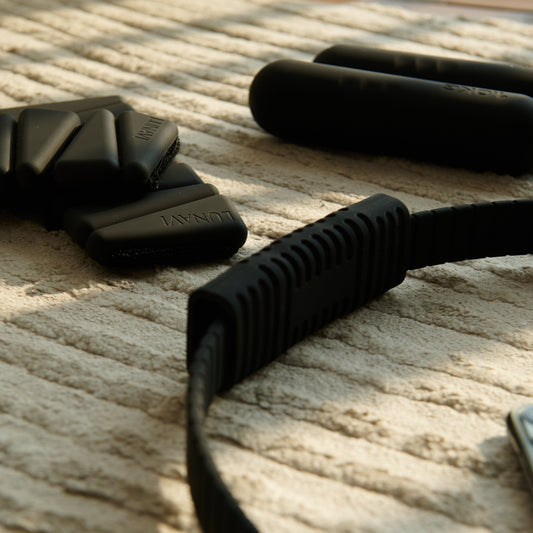 A pilates ring resting on linen, ready for a home practice